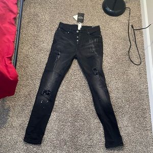 Super skinny distressed paint splat jeans